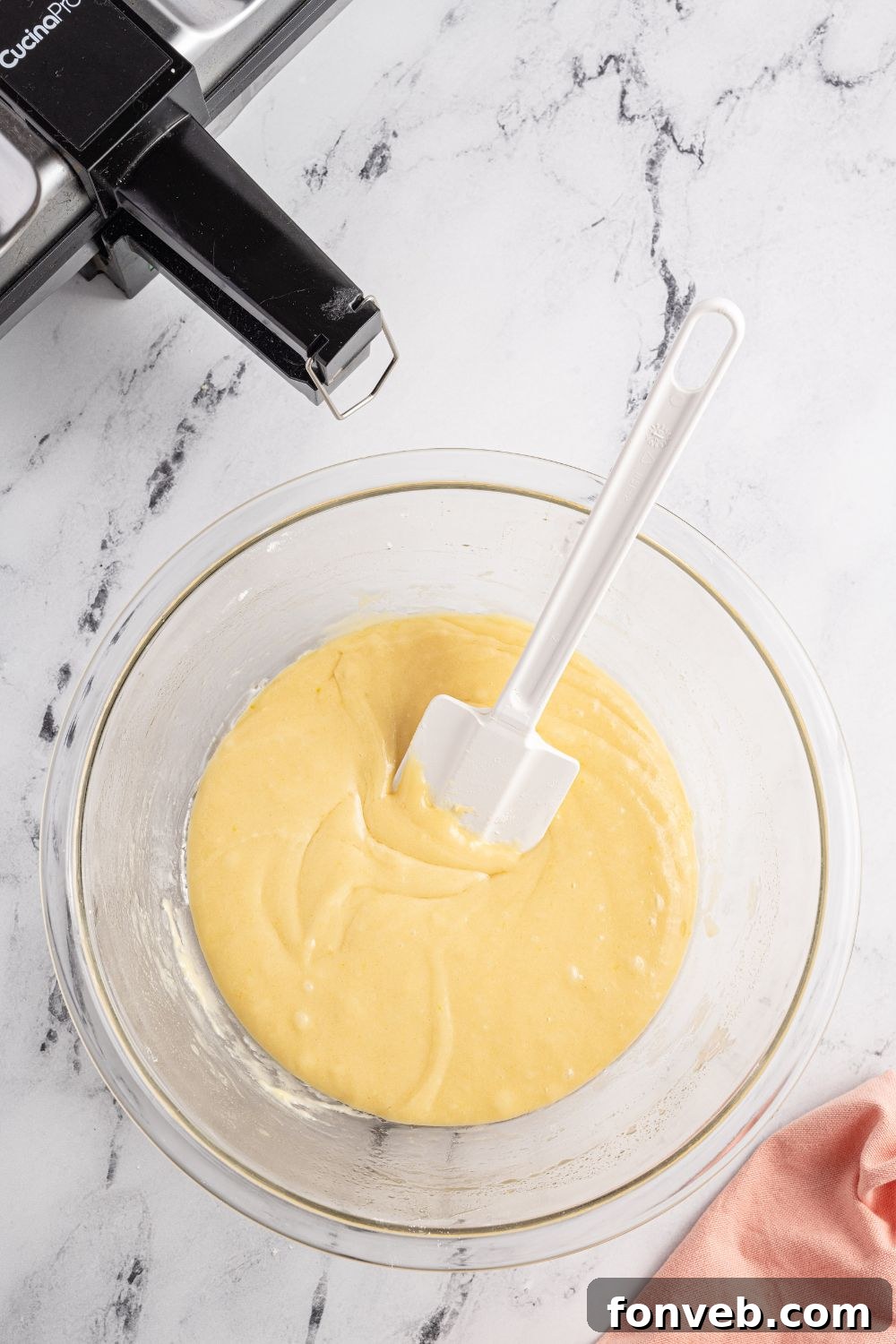 mixing up cookie batter in a bowl 