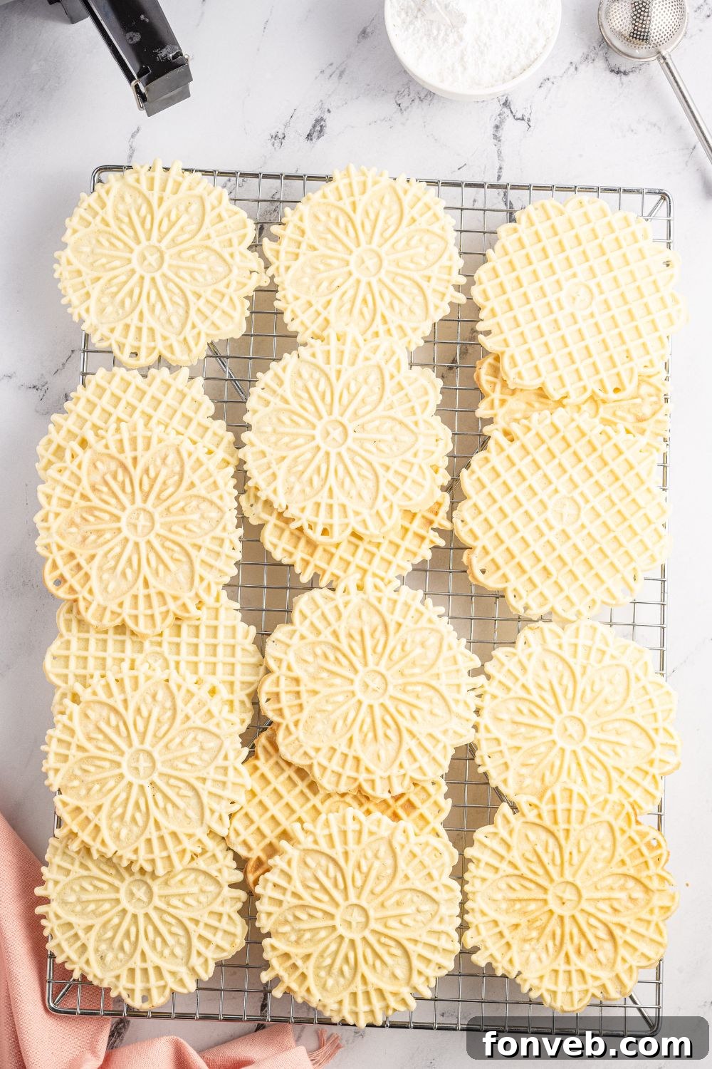 Pizzelles on a cookie tray