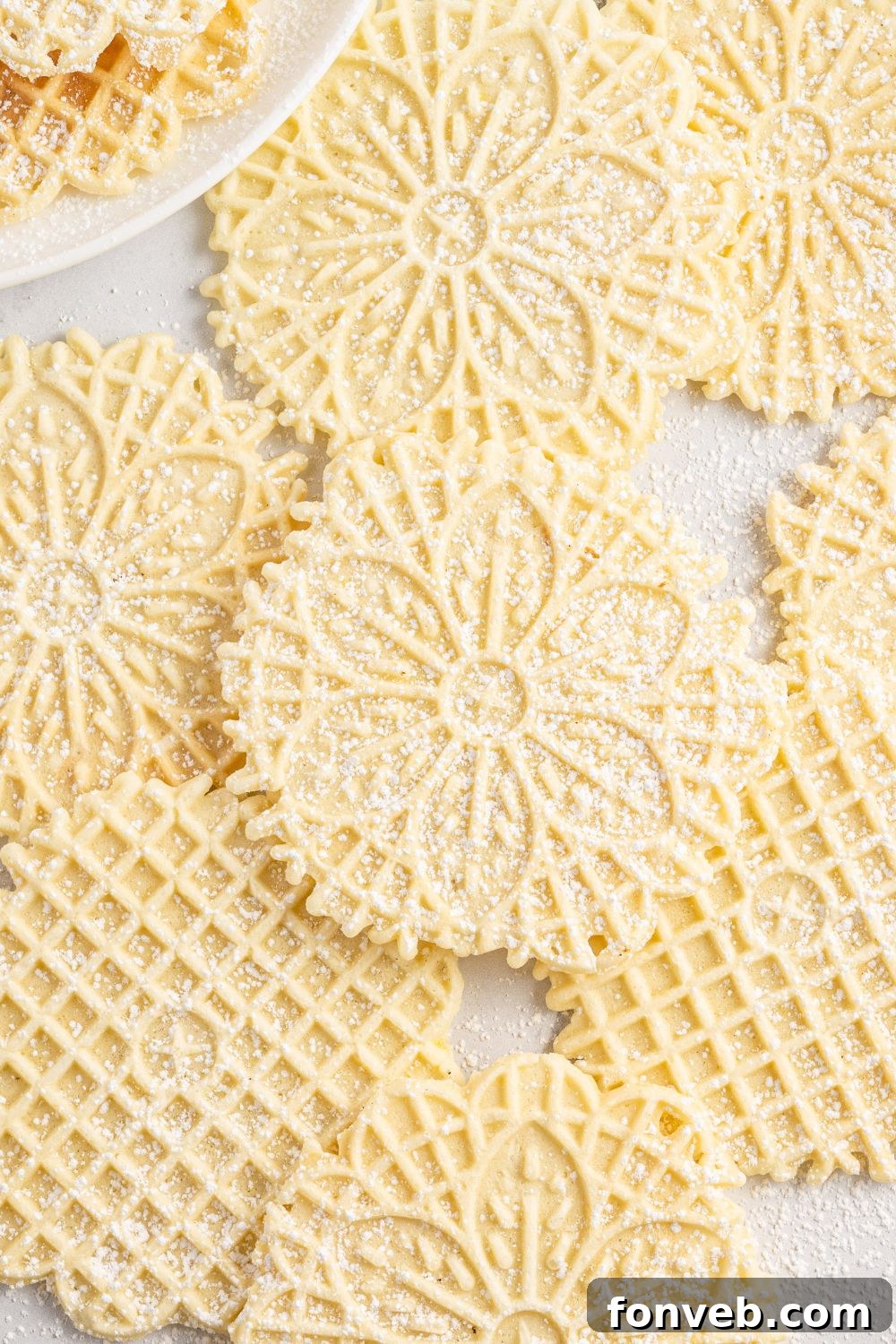 Pizzelles spread out on table 