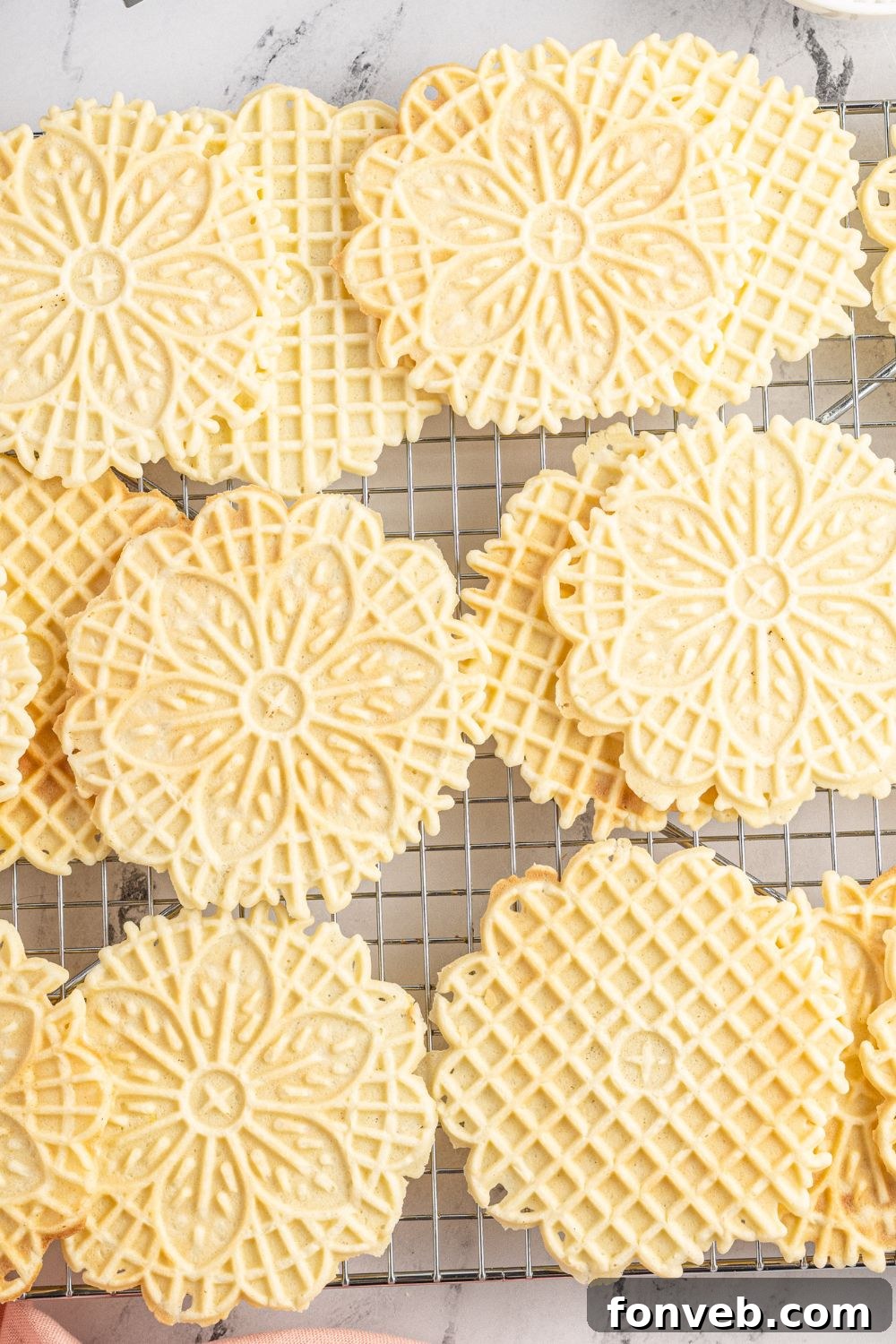 pizzelle cookies on a cooling rack