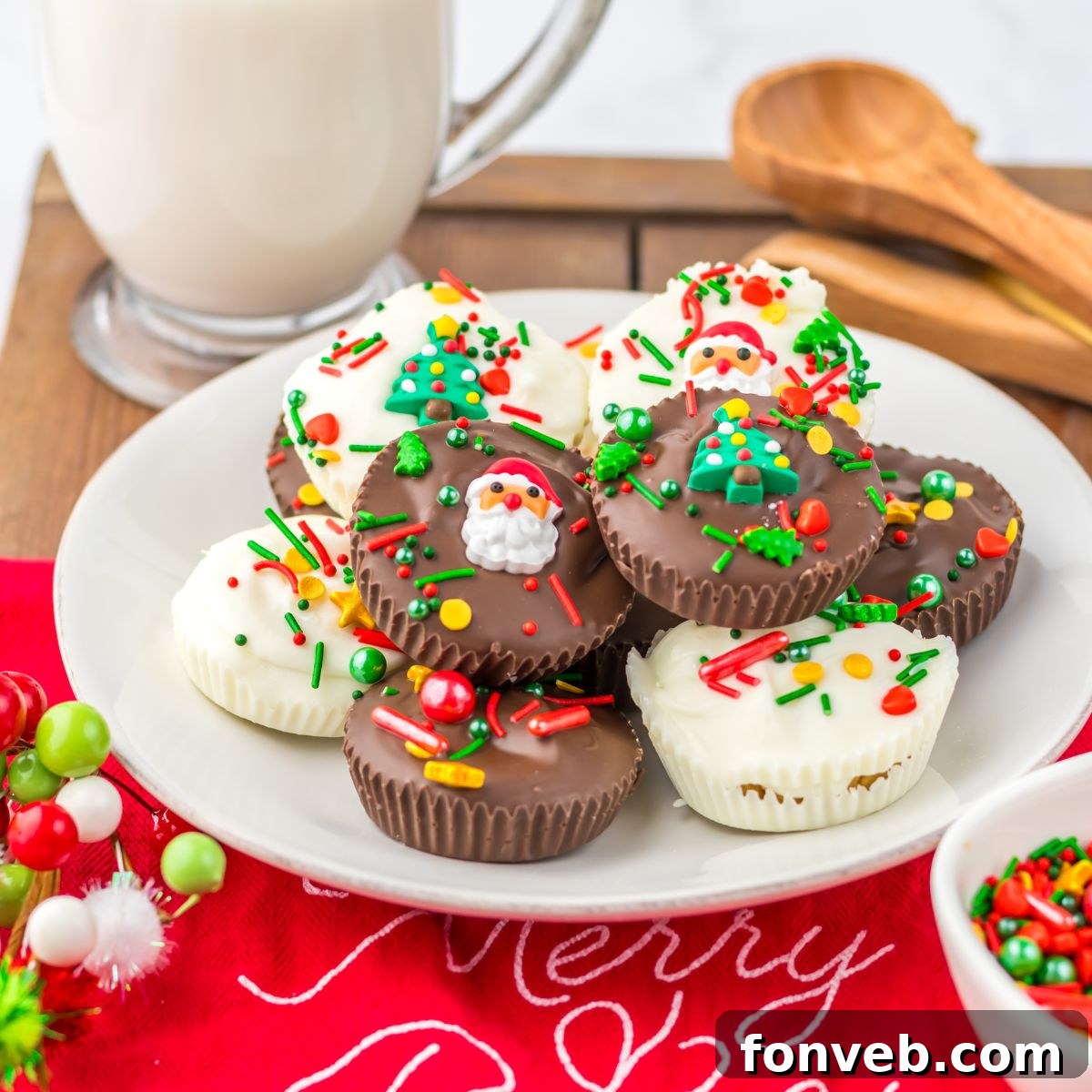Christmas Peanut Butter Cups on a plate with a glass of milk in the background 