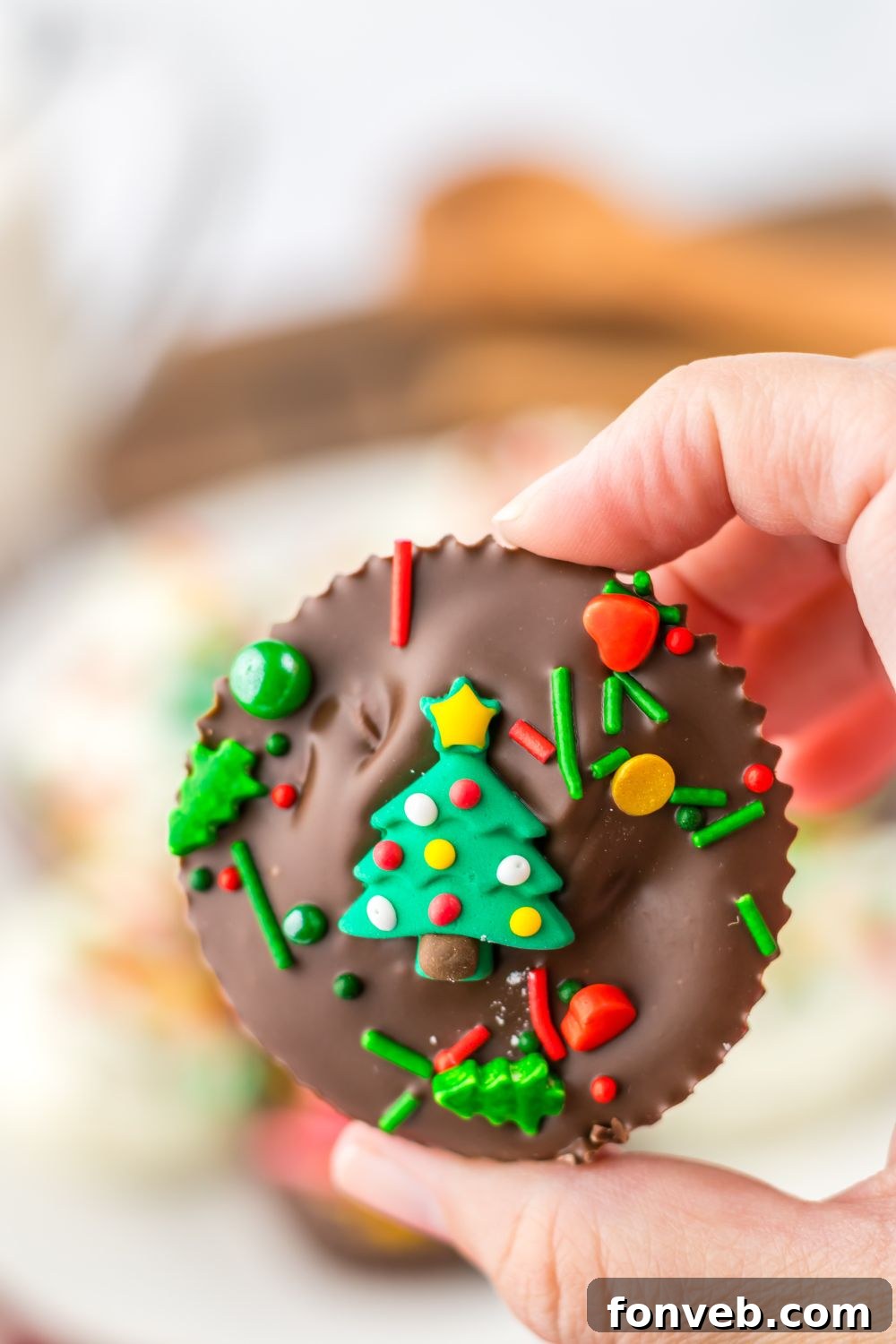 holding a peanut butter cup in hand