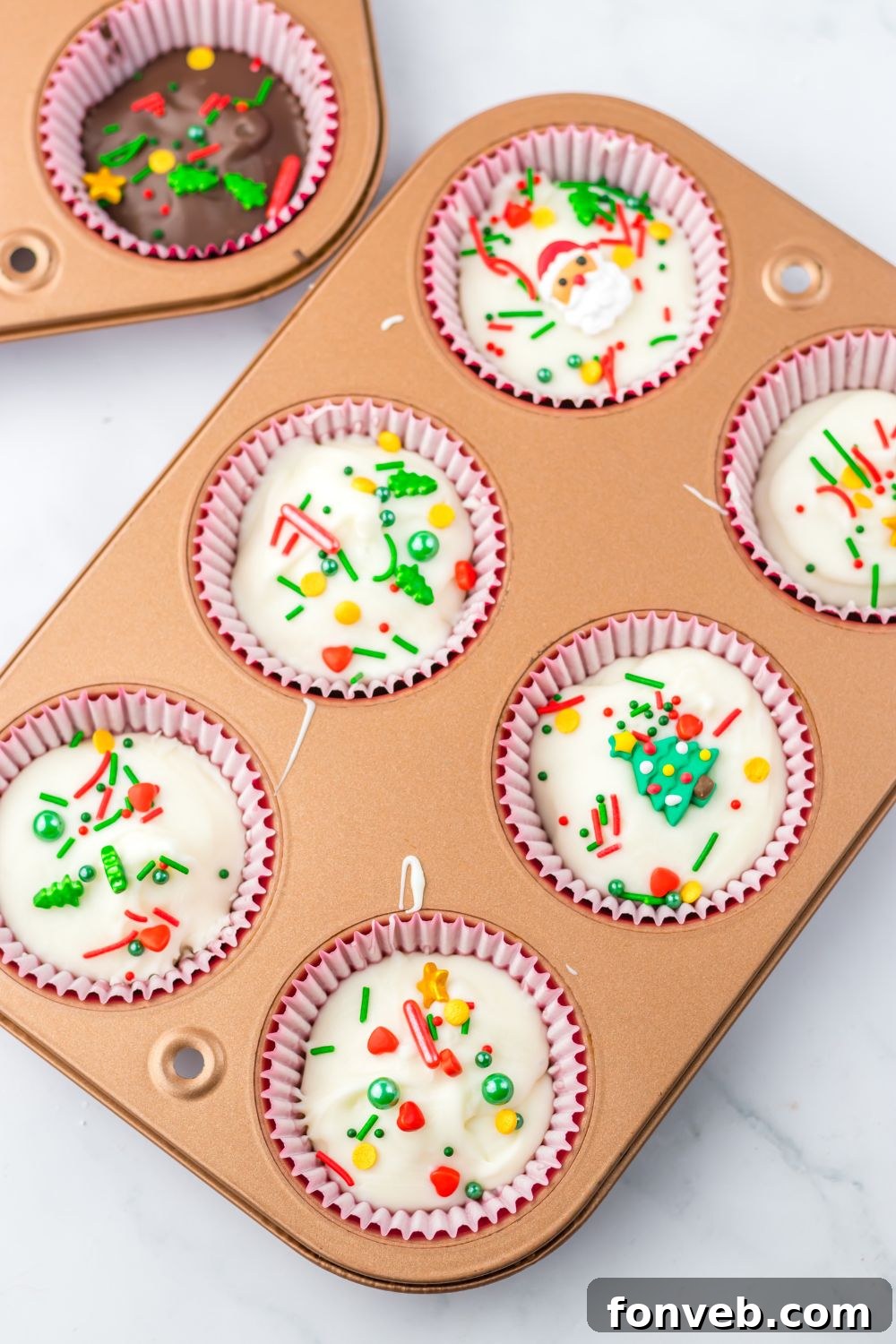 Christmas Peanut Butter Cups in a muffin tin 
