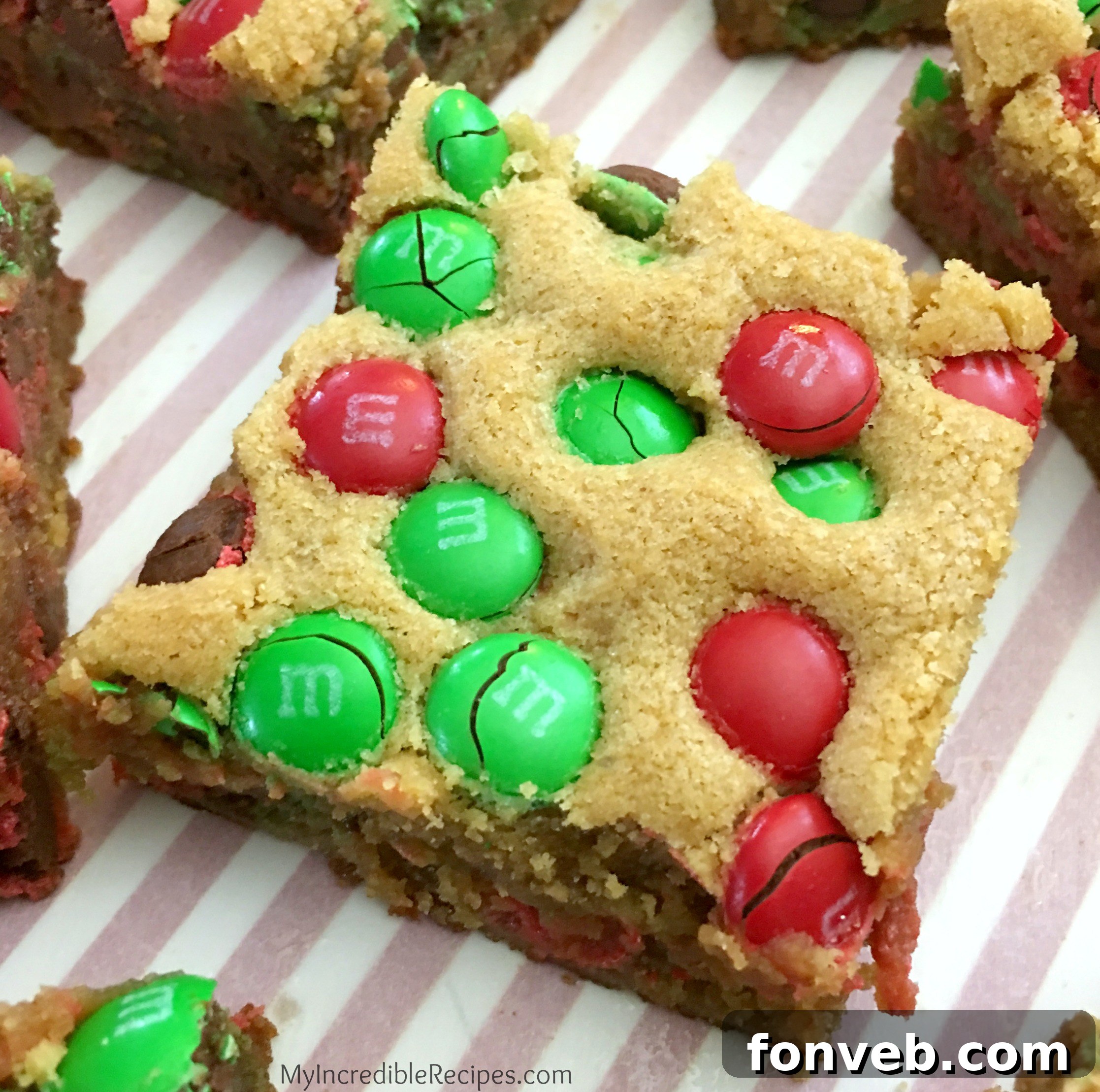 Close-up of a perfectly baked M&M cookie bar showing texture