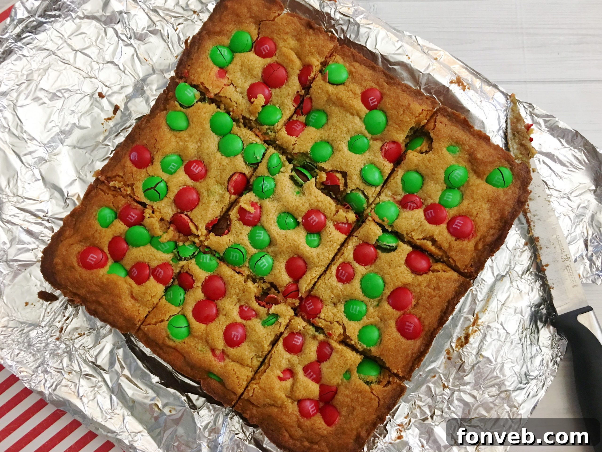 Baked M&M cookie bars cooling in the pan