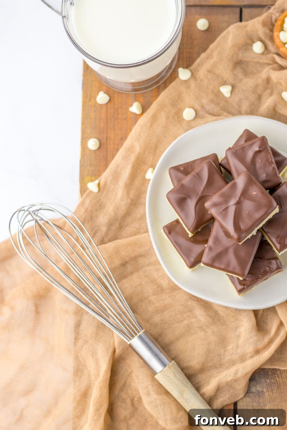 Boston Cream Dream Fudge 15 fudge on plate with whisk to the side