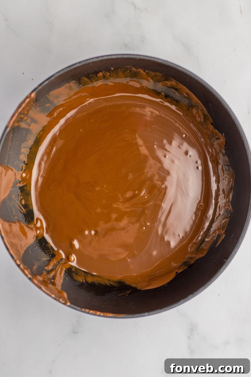 Boston Cream Dream Fudge 9 melted chocolate in a bowl on table