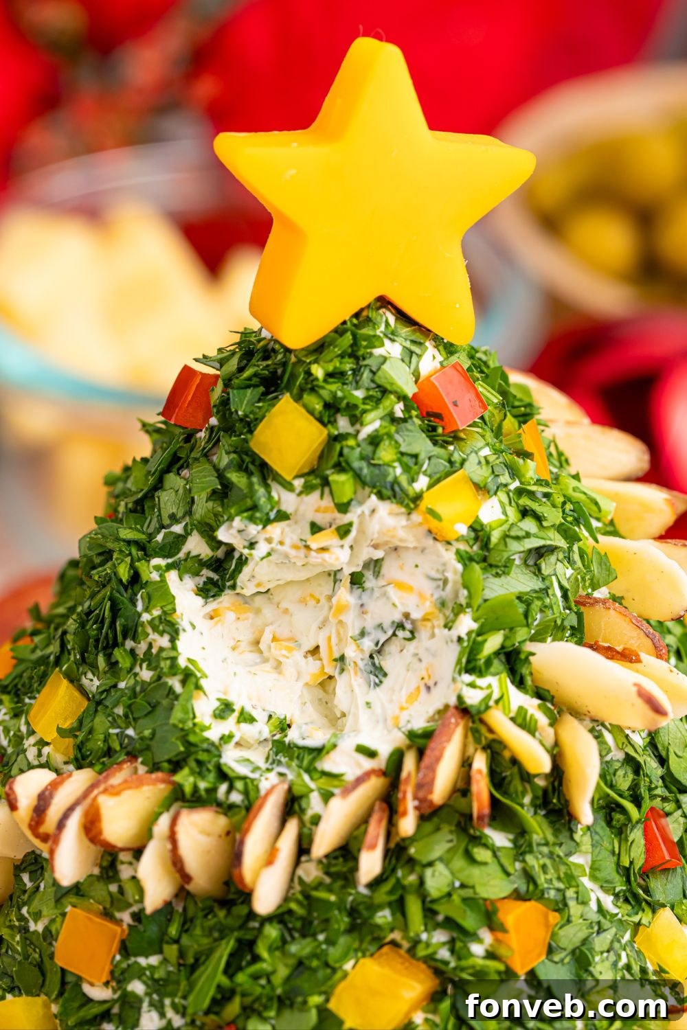 Close-up showing a cheeseball with a portion scooped out, highlighting its creamy texture