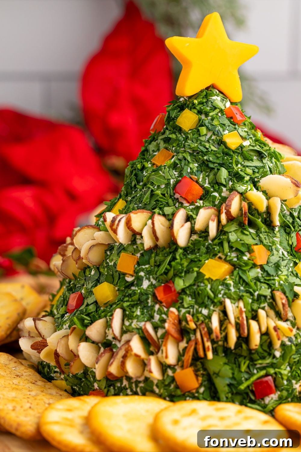 Side profile of the Christmas Tree Cheeseball on a festive table setting