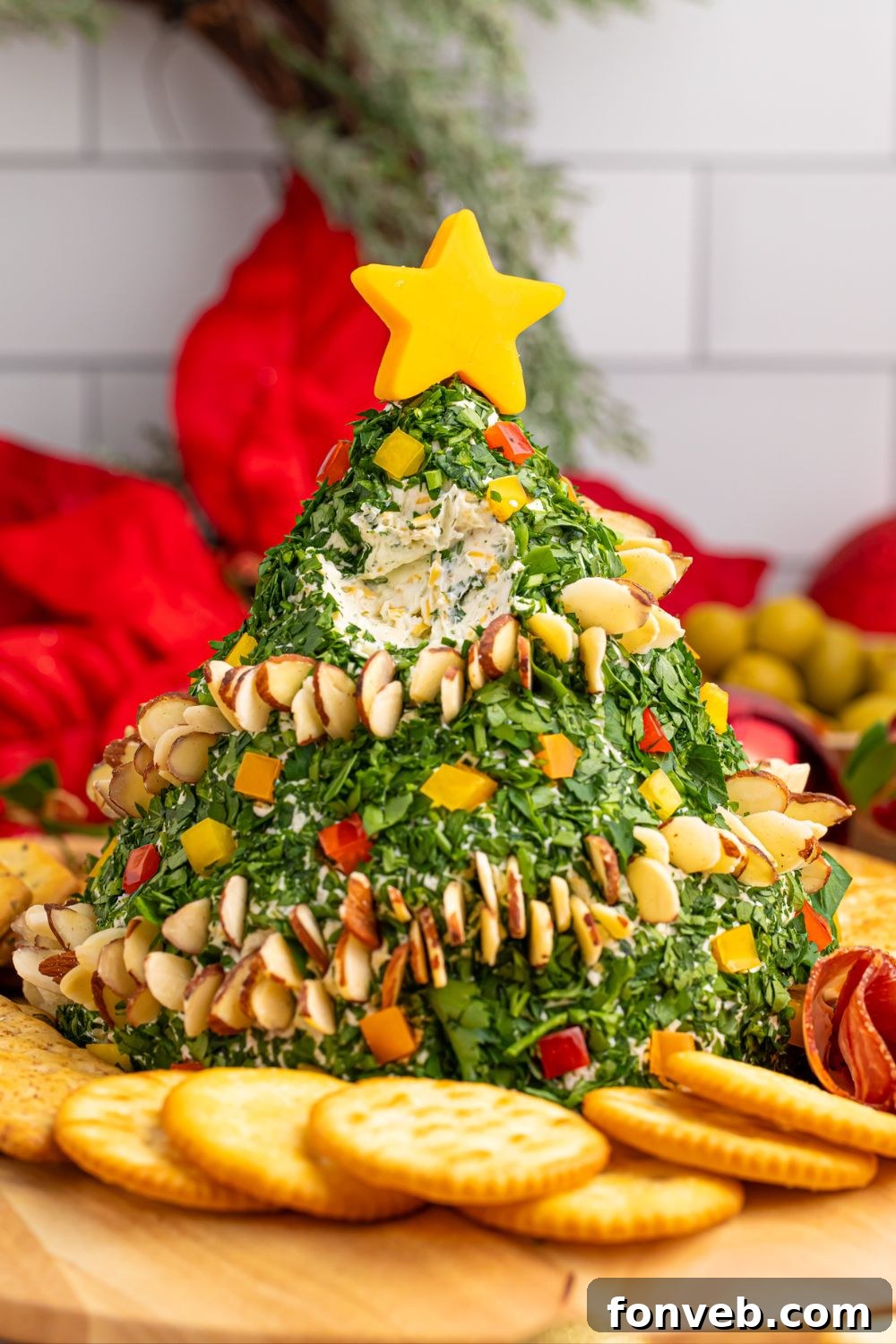 Cheeseball shaped like a tree with a portion removed, inviting guests to enjoy