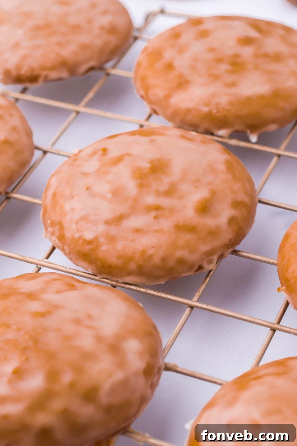 A selection of freshly baked German cookies cooling gracefully on a wire rack.