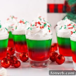 Yuletide Jiggle Shots 21 Christmas Jello Shots on table with decorations around it