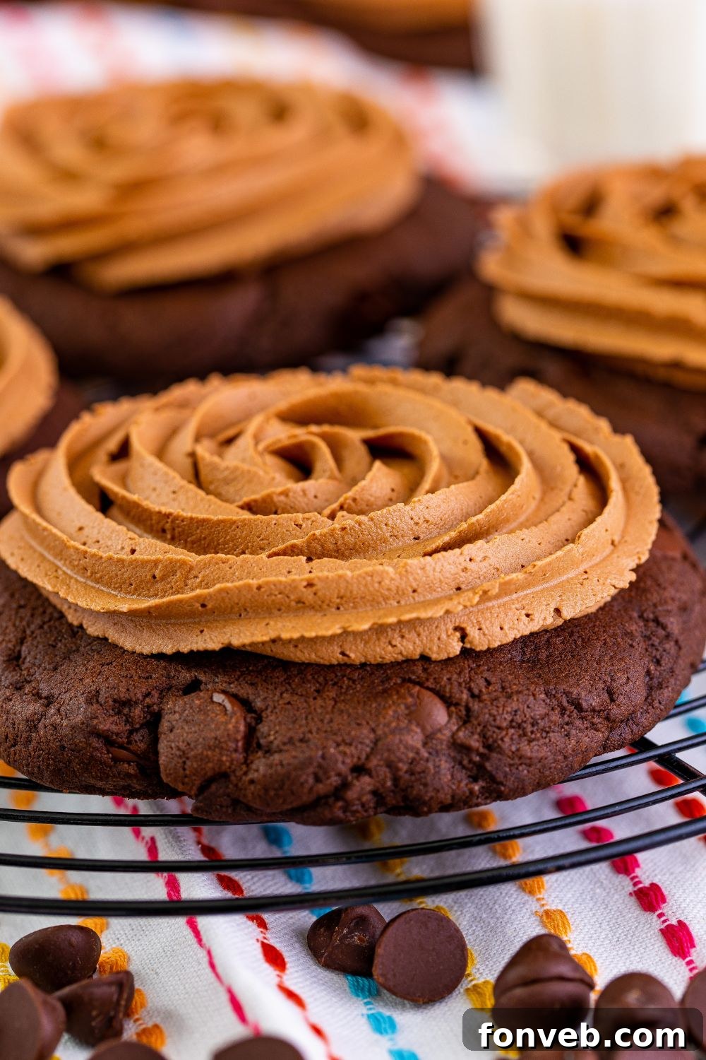 Frosted Chocolate Cake Cookies cooling on a wire tray, their rich fudge frosting perfectly set