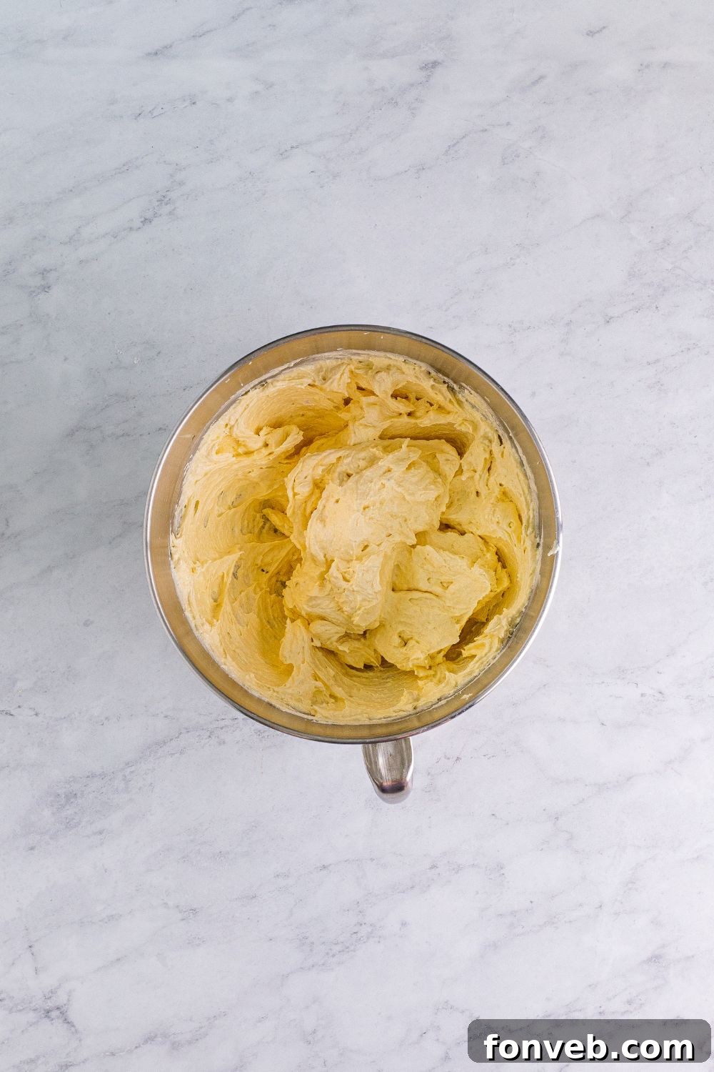 Creamed butter and granulated sugar, light and fluffy in a stand mixer bowl, an essential step for soft Chocolate Cake Cookies
