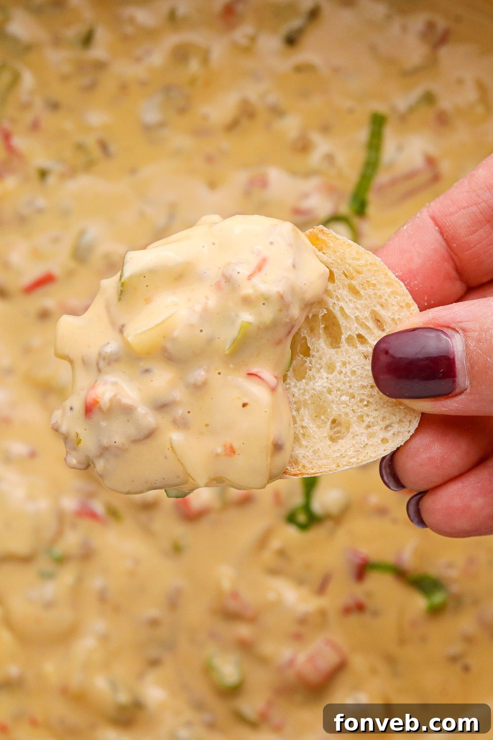 Crock Pot Philly Cheesesteak Dip on a piece of sliced bread