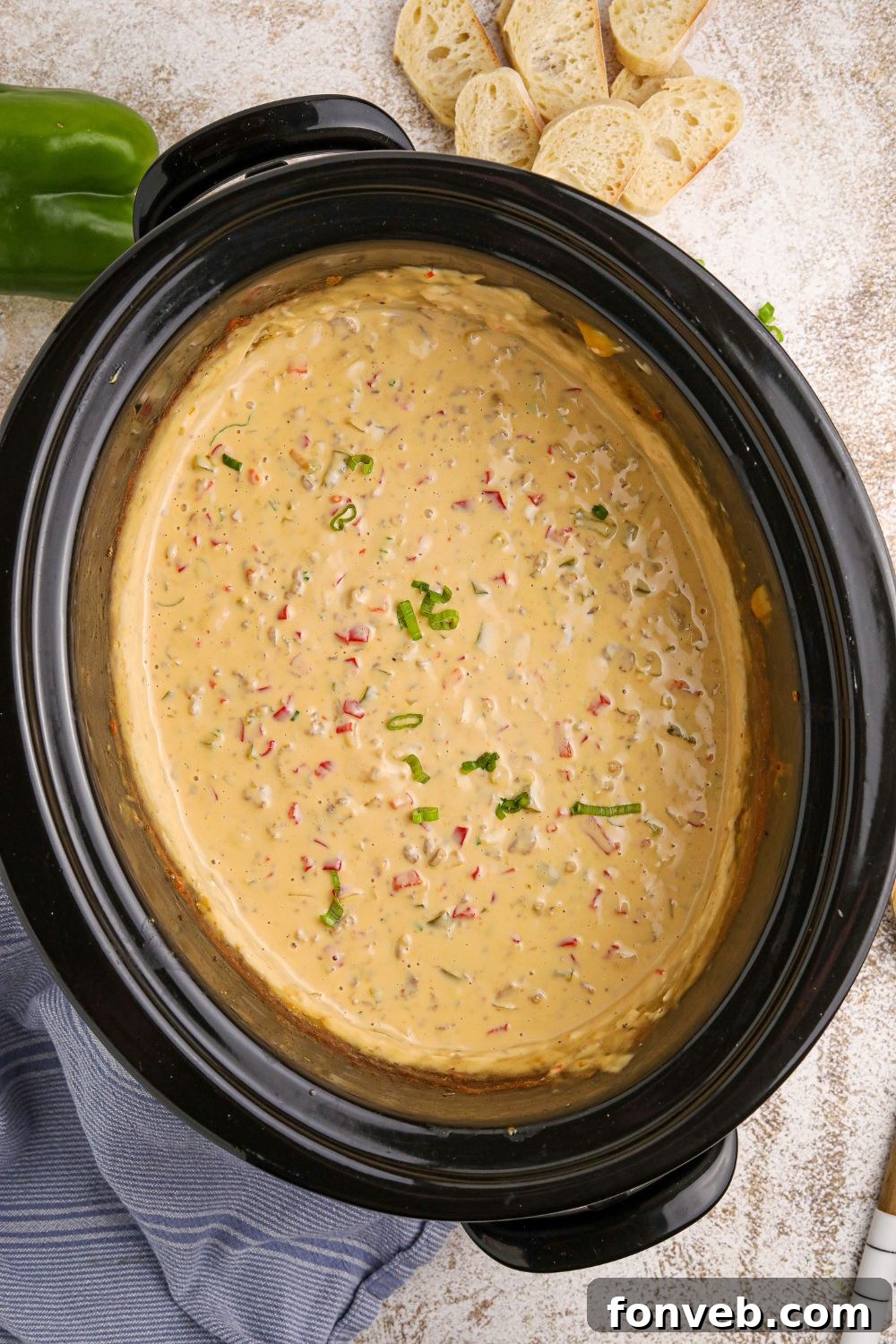 overhead view of Crock Pot Philly Cheesesteak Dip in a slow cooker sitting on counter