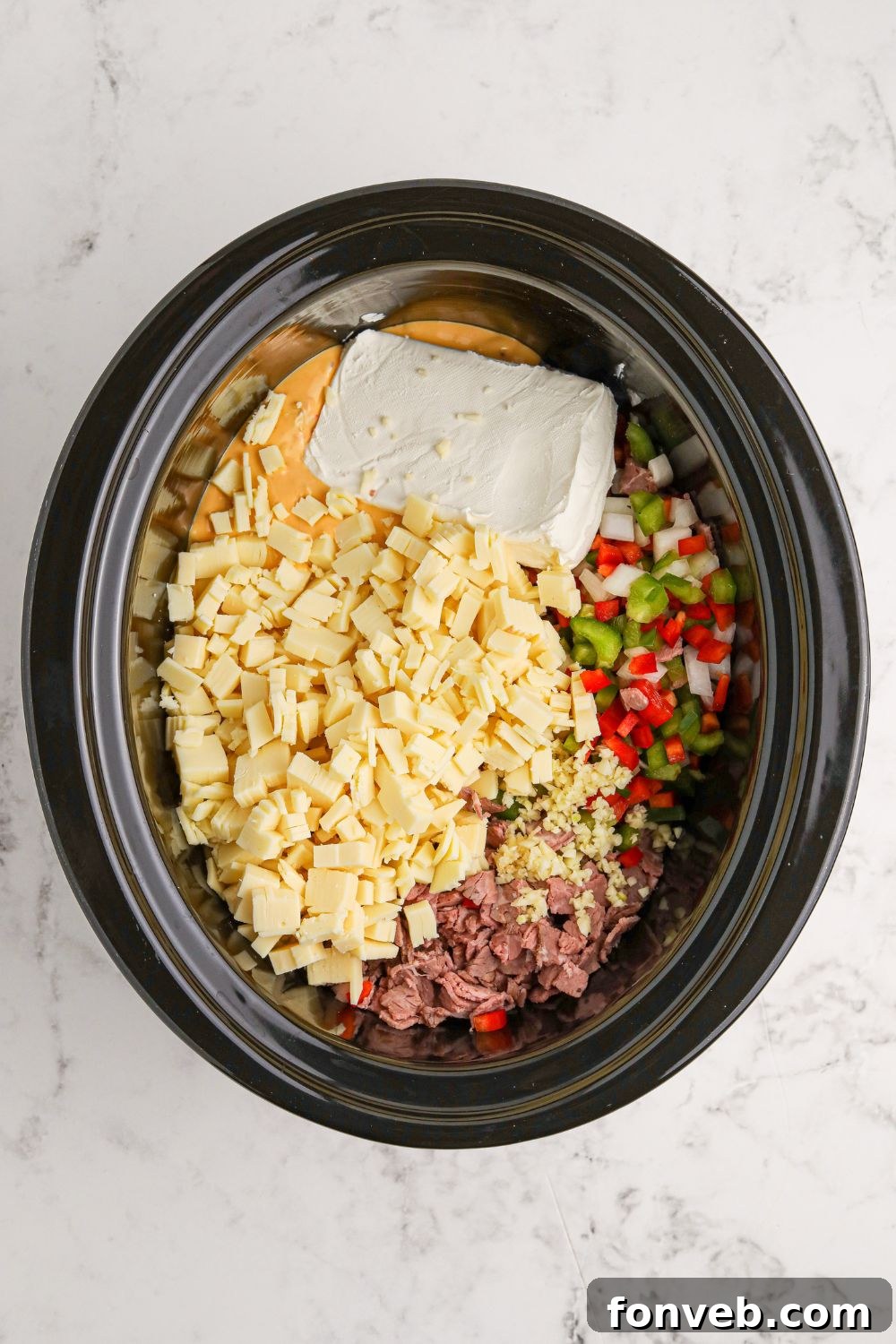 Crock Pot Philly Cheesesteak Dip in an oval crockpot
