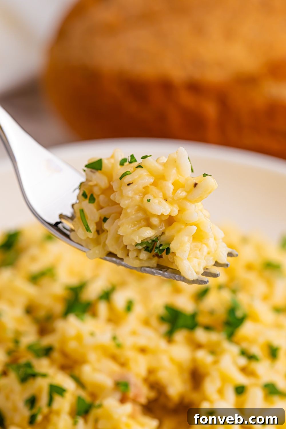 Close-up of Souper Rice on a fork with parsley, highlighting its texture.