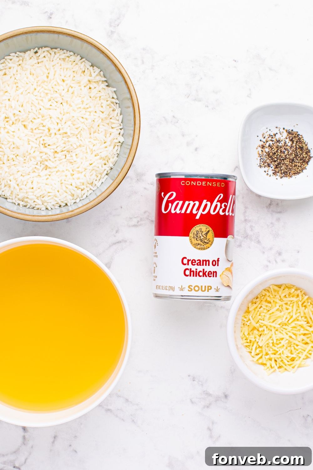 All Souper Rice ingredients displayed in separate bowls: instant rice, chicken broth, black pepper, Parmesan cheese, and a can of condensed soup.