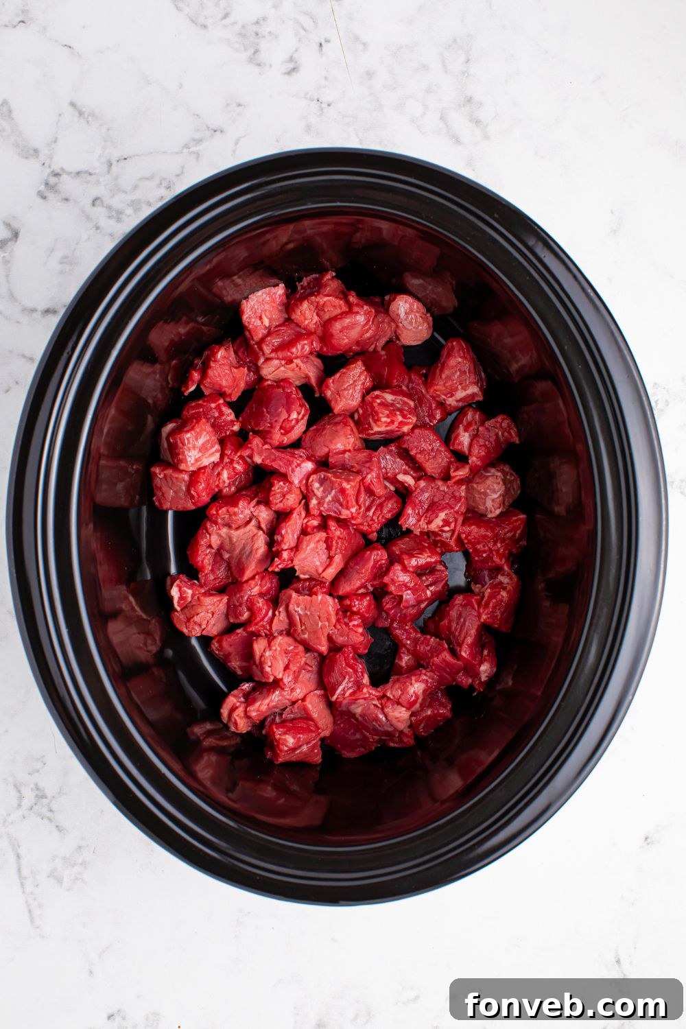 Tender Mississippi Crockpot Steak Bites 8 Raw diced steak bites ready for slow cooking.
