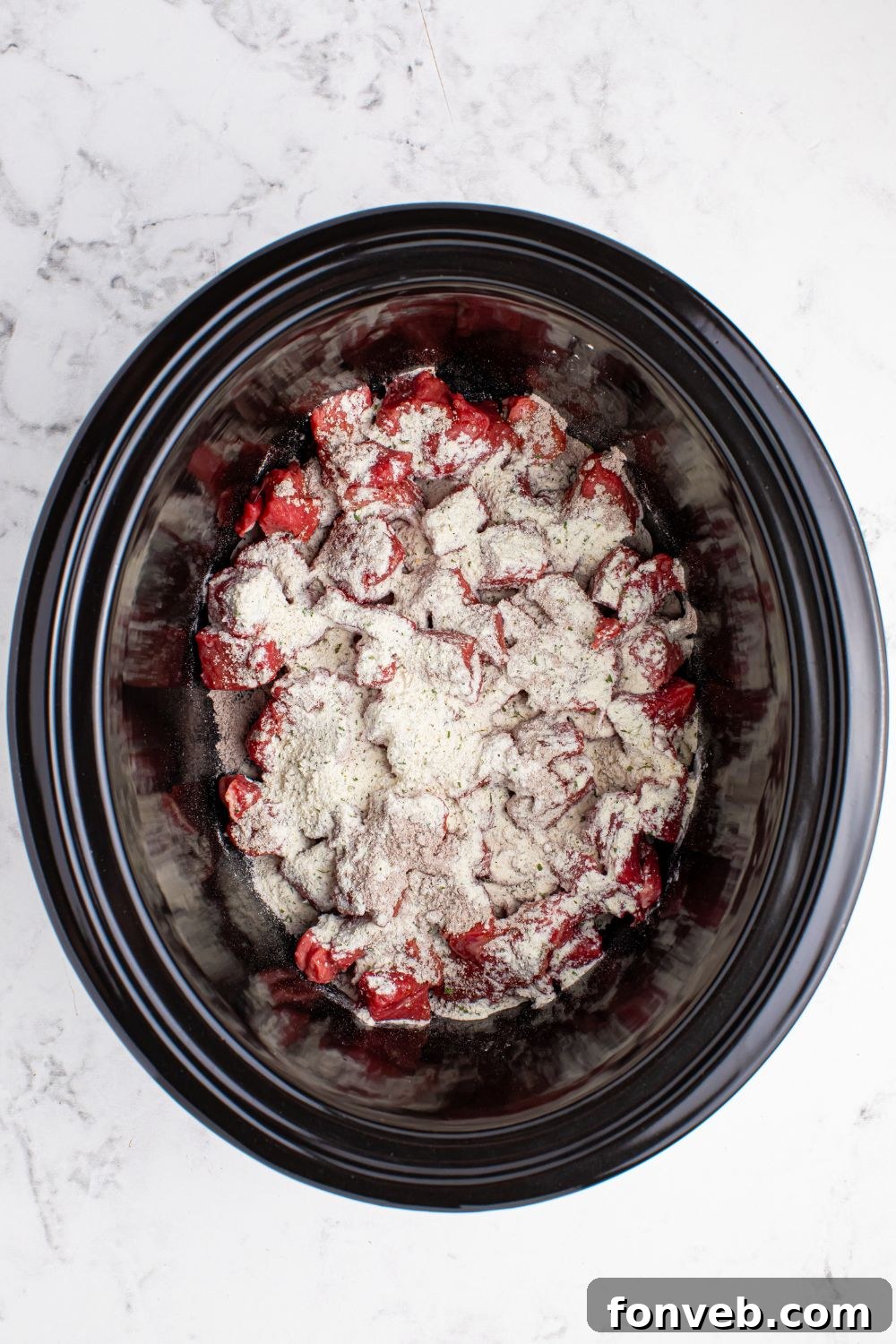 Tender Mississippi Crockpot Steak Bites 9 Diced steak with ranch and au jus seasoning sprinkled on top.