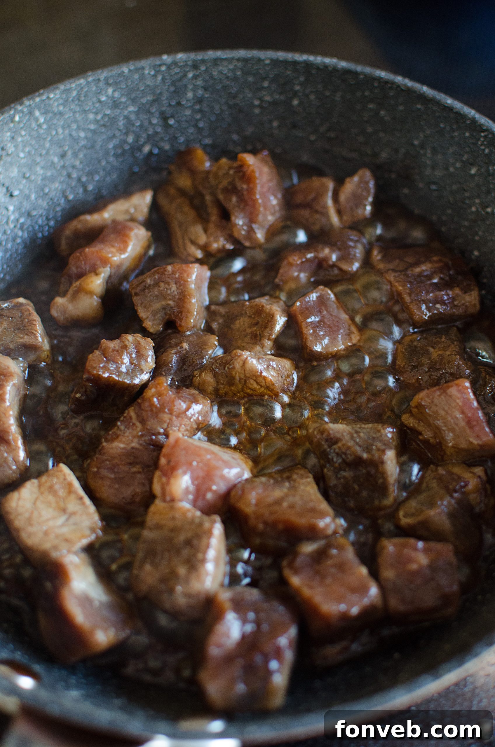 Honey being poured into a bowl with marinade ingredients