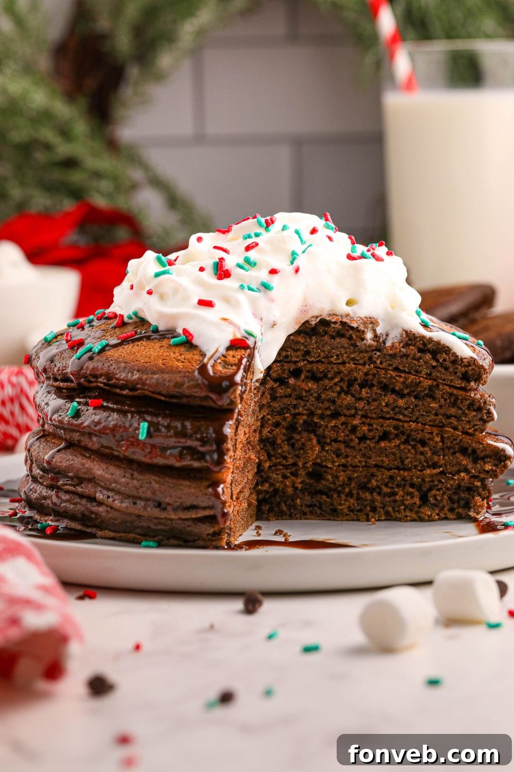 Decadent Hot Chocolate Pancakes 13 Hot Chocolate Pancakes on plates with a bit of pancakes sliced out of plate