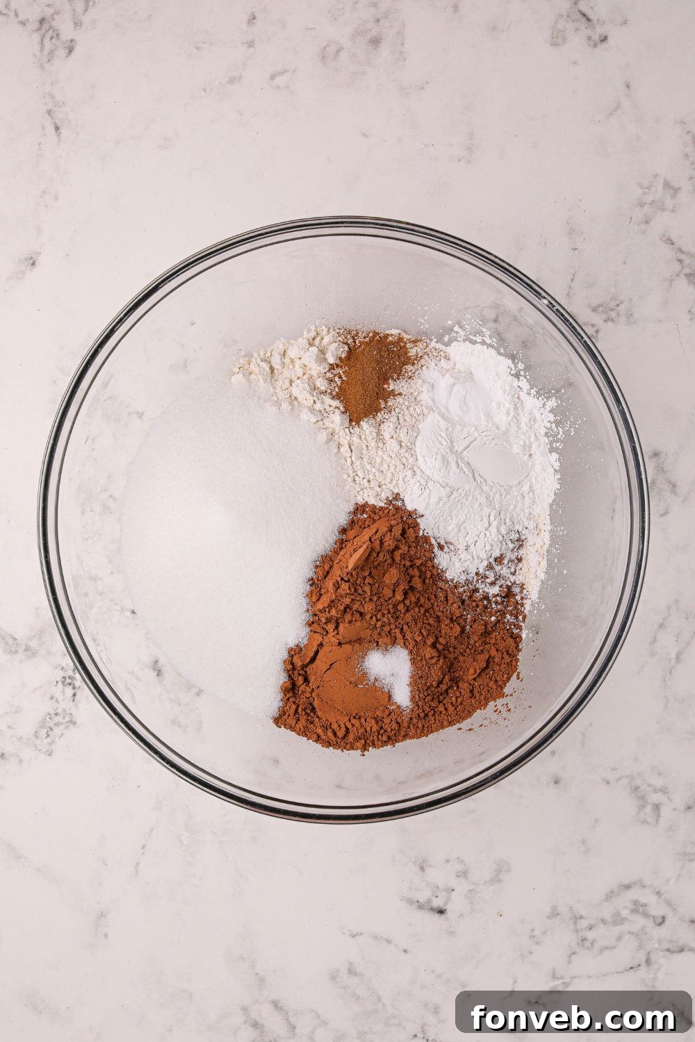 Decadent Hot Chocolate Pancakes 6 dry ingredients for Hot Chocolate Pancakes in a glass bowl on table