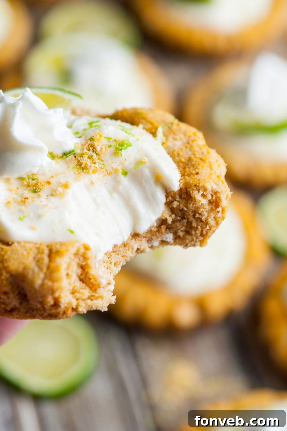 Tangy Key Lime Pie Cookies 16 Crumbl Key Lime Pie Cookie in hand with a bite taken out of it