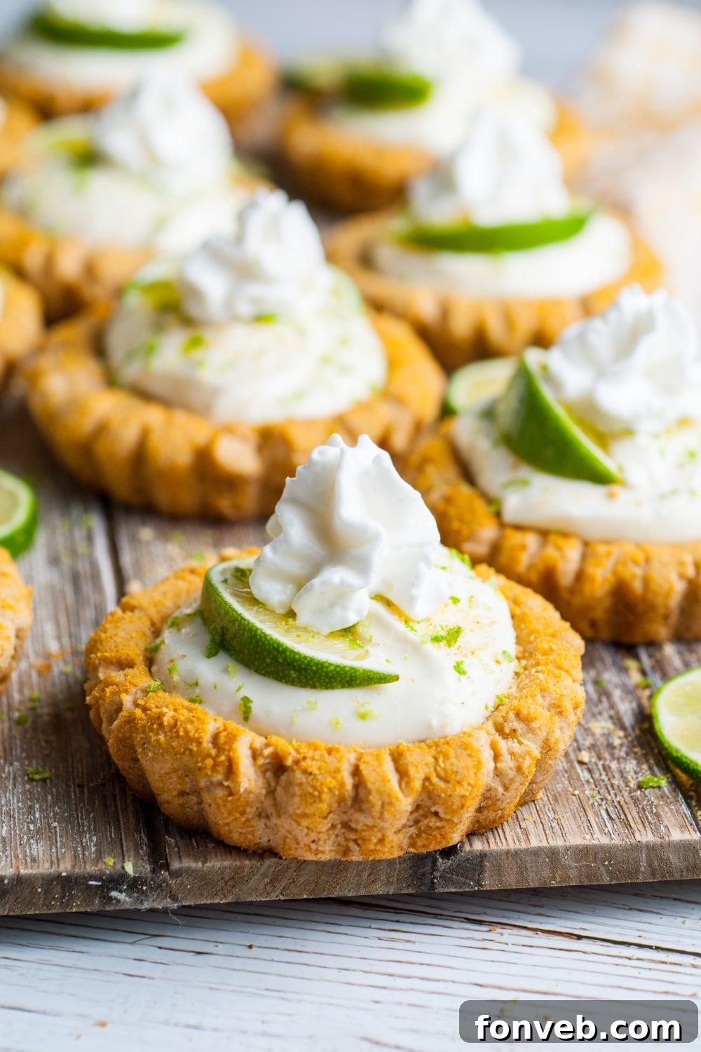 Tangy Key Lime Pie Cookies 18 Crumbl Key Lime Pie Cookies lined out on a cutting board on table