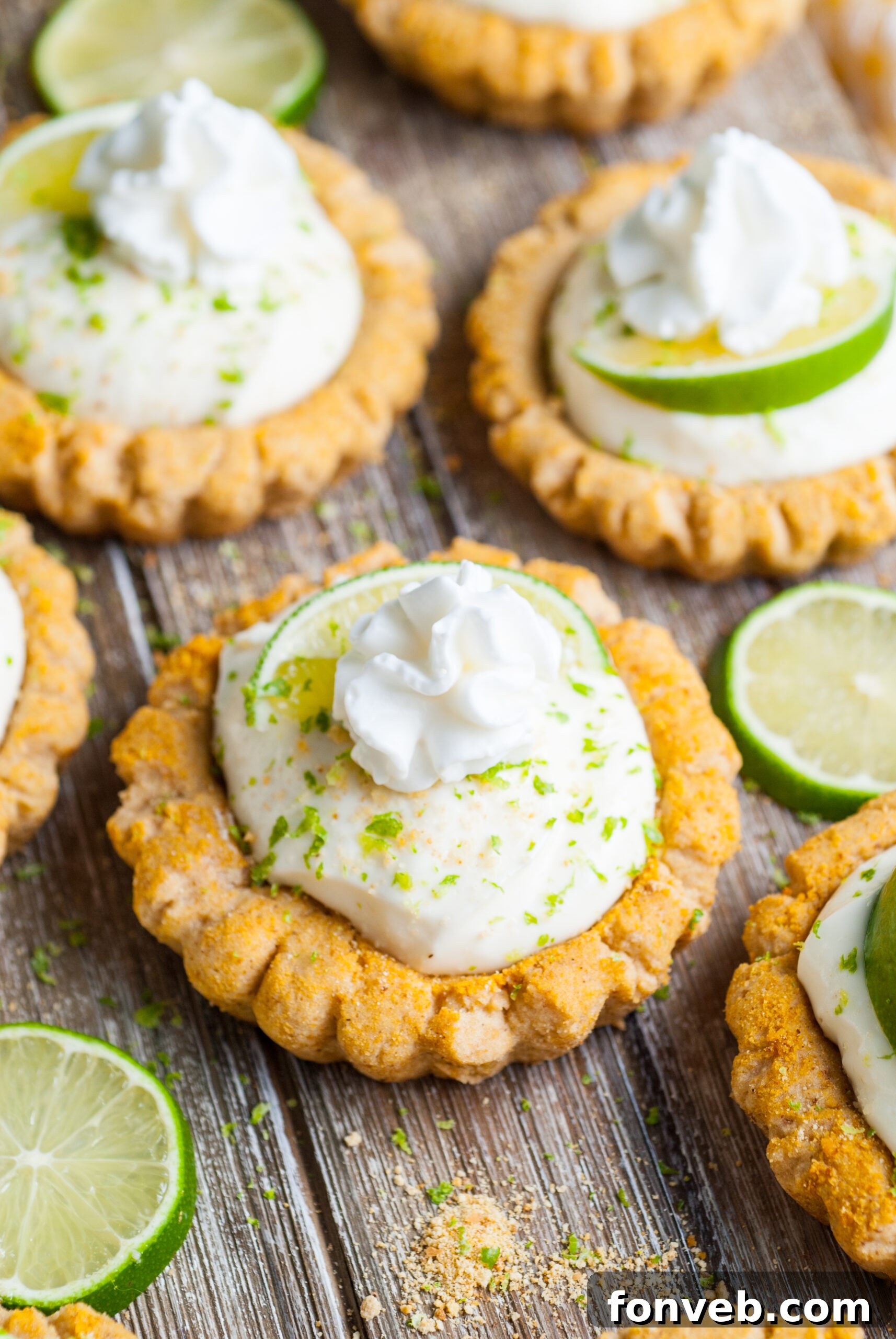 Tangy Key Lime Pie Cookies 21 Crumbl Key Lime Pie Cookies on table with lime wedges