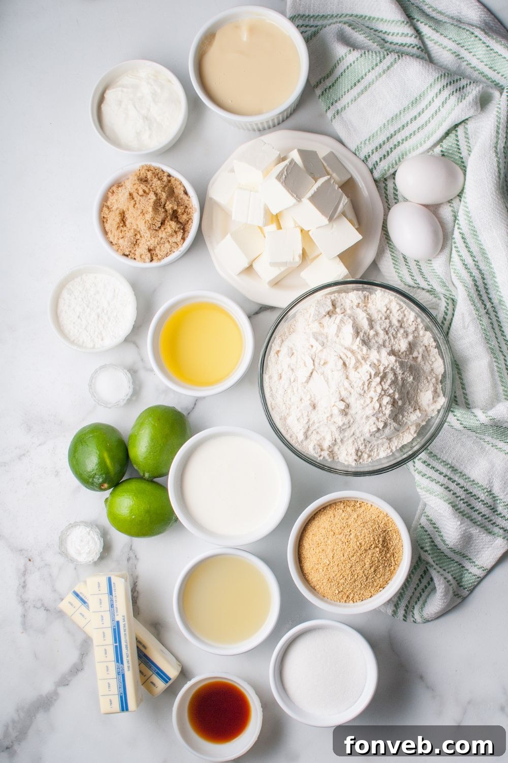 Tangy Key Lime Pie Cookies 5 Crumbl Key Lime Pie Cookies- all the ingredients for the key lime pie cookies in single serve bowls on the table with a towel under it