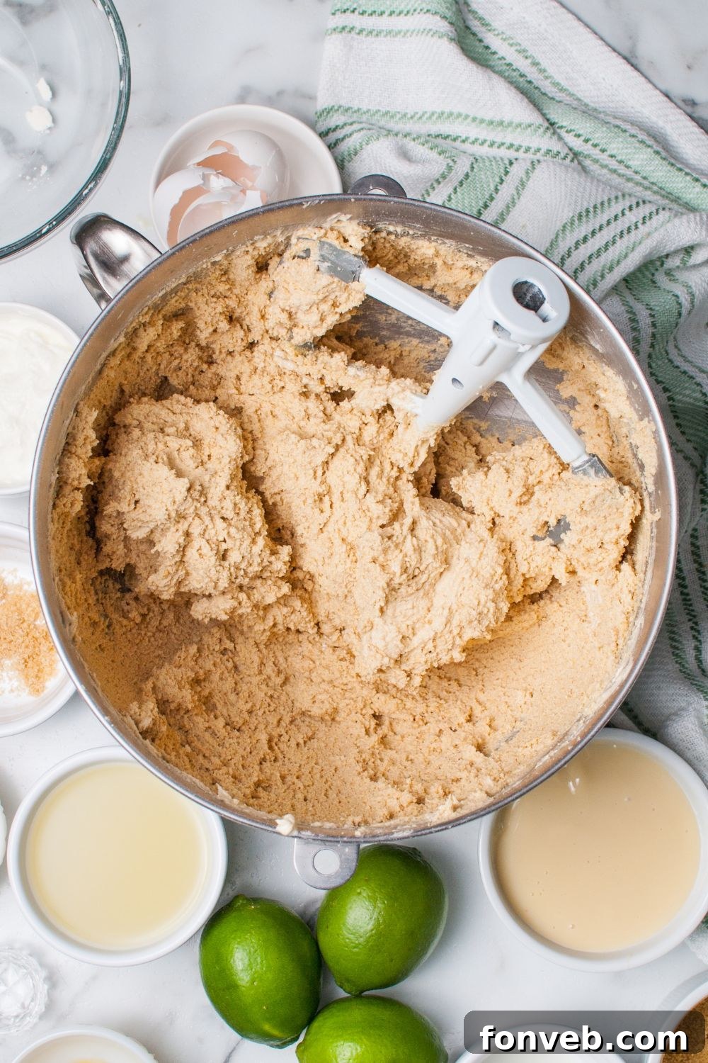 Tangy Key Lime Pie Cookies 6 Crumbl Key Lime Pie Cookie dough in a mixing bowl on table
