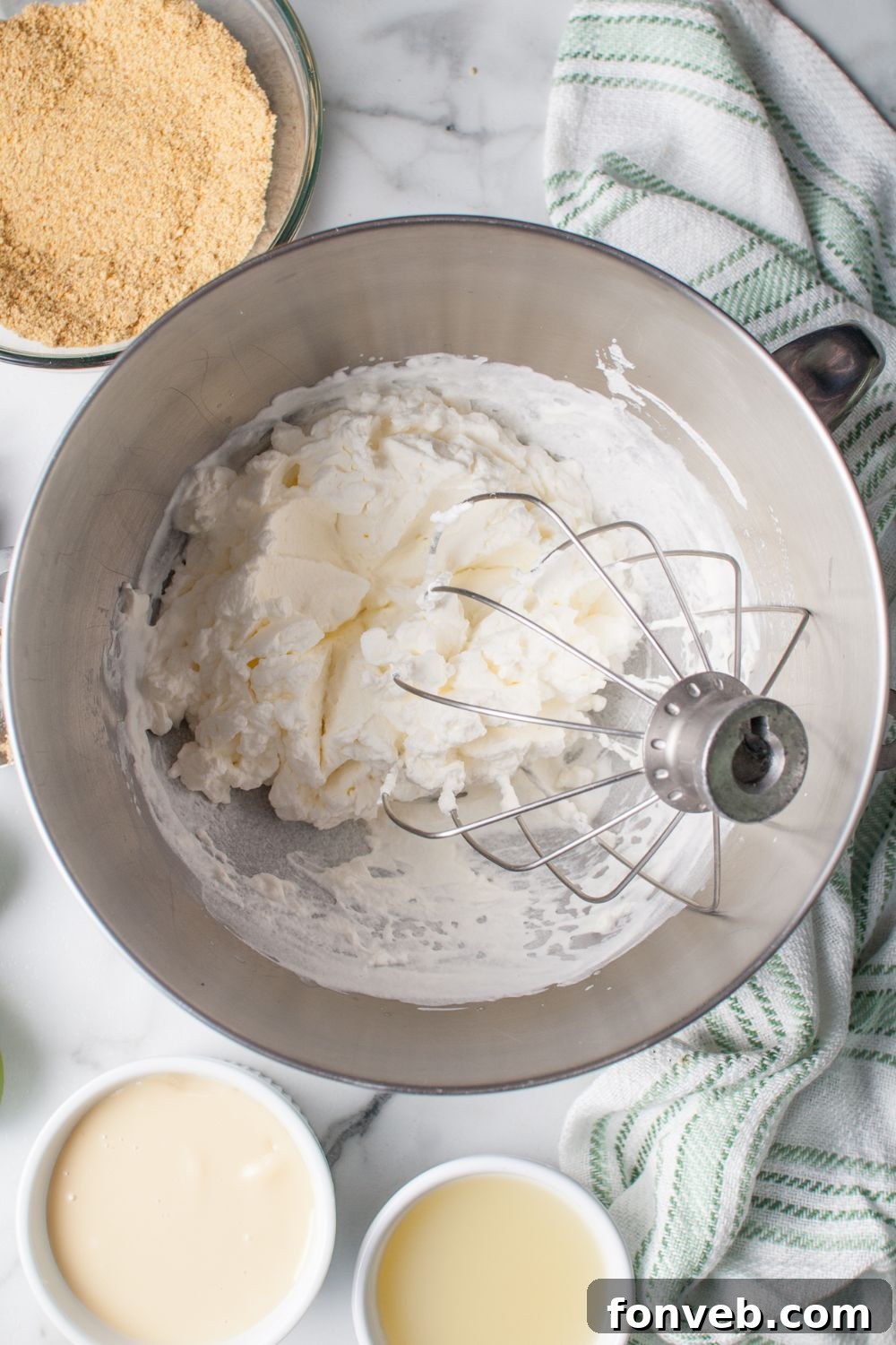 Tangy Key Lime Pie Cookies 10 whipped cream cheese in a mixer bowl for the Crumbl Key Lime Pie Cookies