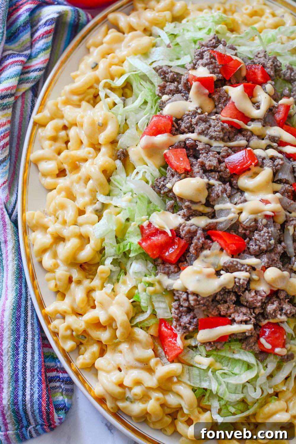 Big Mac Macaroni And Cheese side view of the dish stacked on top of each other on a platter 