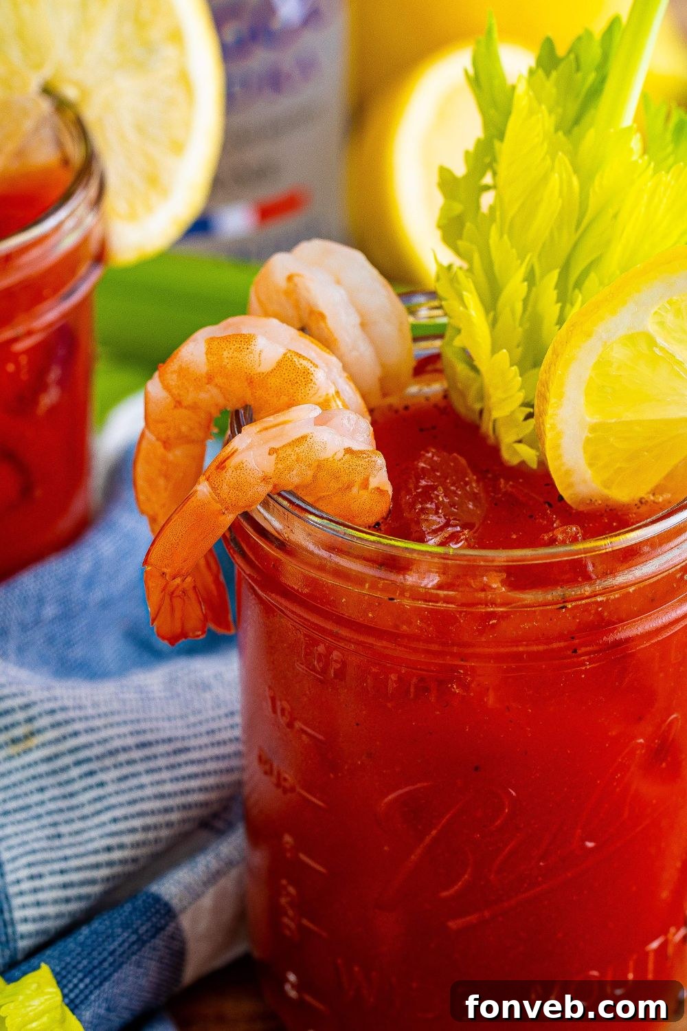 Bloody Mary close up in glass with srhimp and celery in glass 