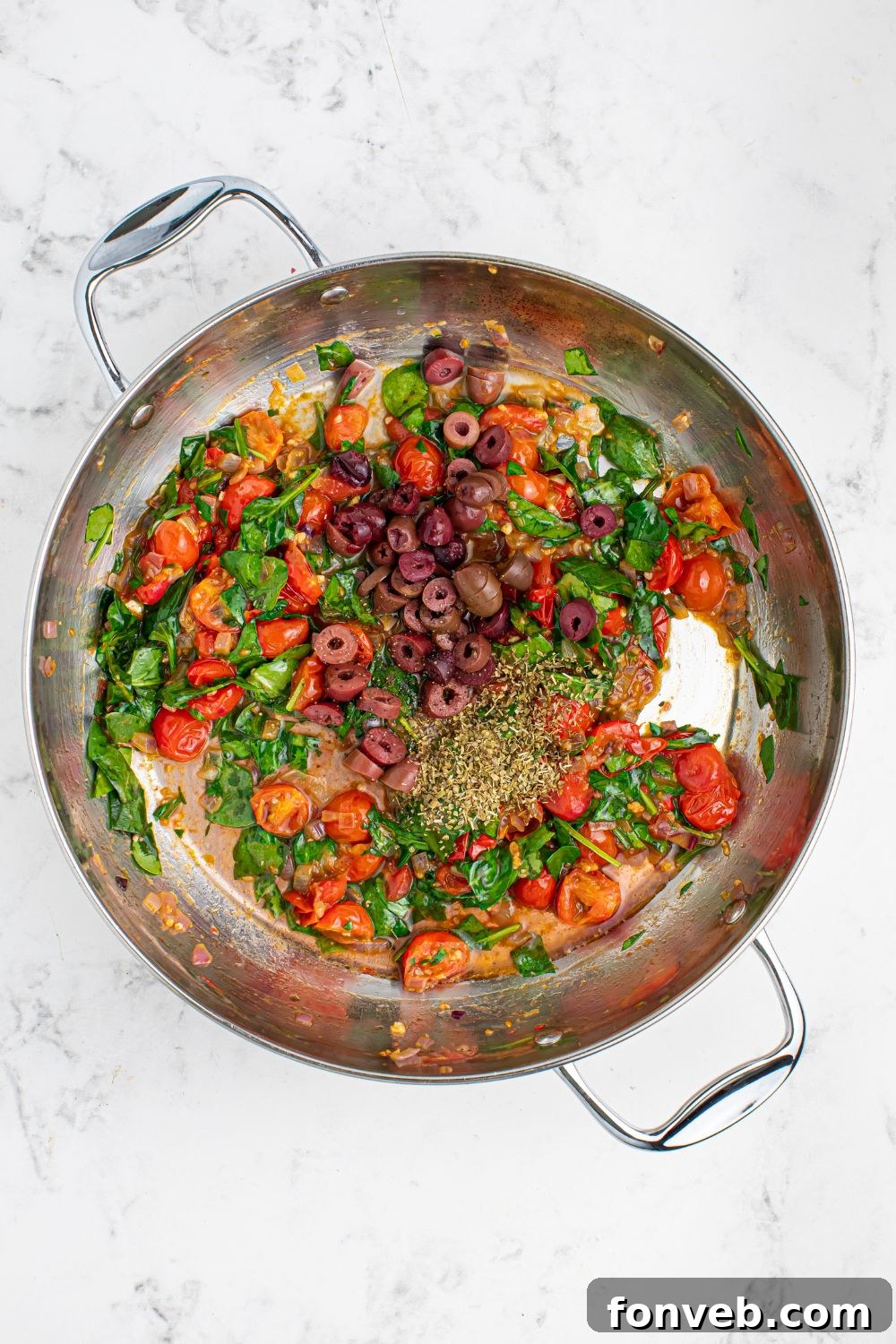 sauted vegetables for Greek Spaghetti in a pan on table