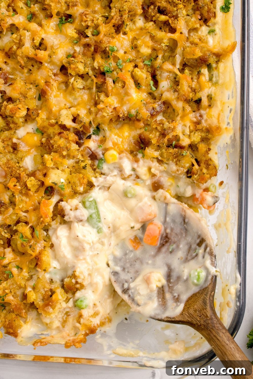 Savory Chicken Stuffing Bake 13 Chicken Stuffing Casserole in pan with a few scoops missing from pan showing the center of the casserole