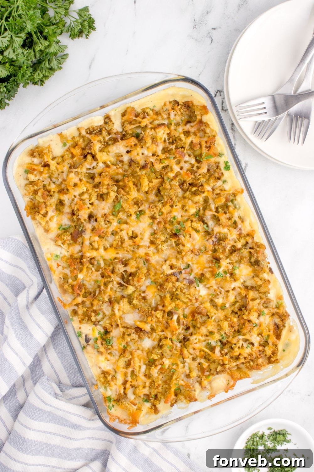 Savory Chicken Stuffing Bake 4 Chicken Stuffing Casserole in a pan on table with an overhead view of it in the casserole dish