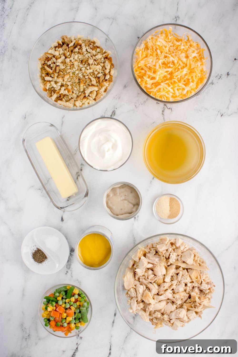 Savory Chicken Stuffing Bake 5 Chicken Stuffing Casserole ingredients in glass bowls sitting on table to showcase what you need for cassserole