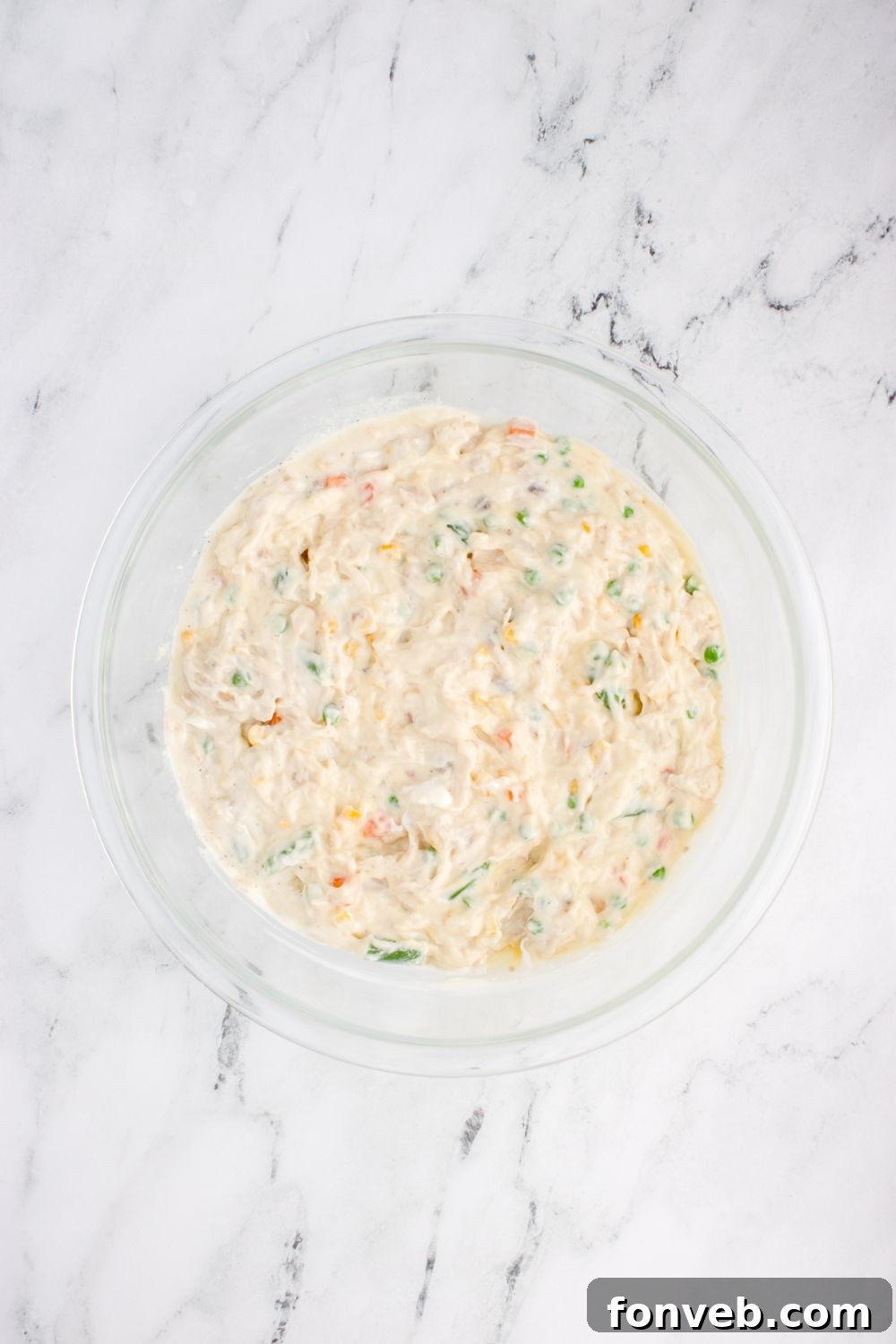 Savory Chicken Stuffing Bake 7 glass bowl with Chicken Stuffing Casserole filling in it