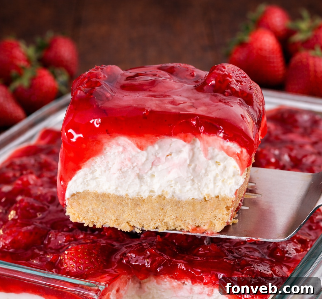 No Bake Strawberry Delight being lifted up by a spatula 