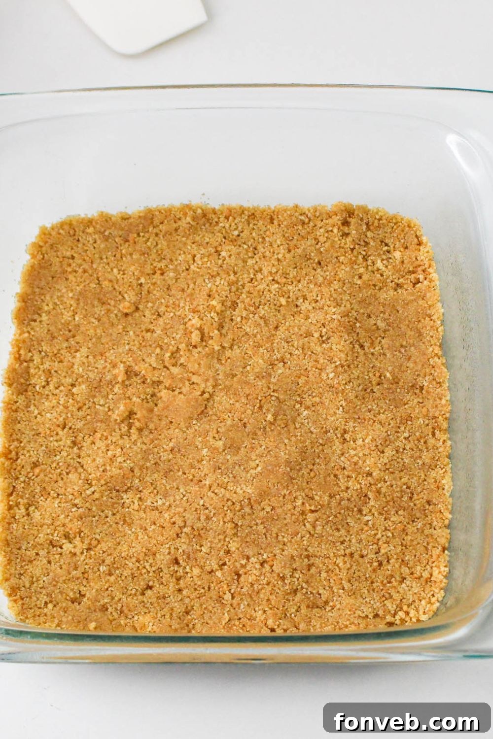 graham cracker crust pressed into pan for the No Bake Strawberry Delight