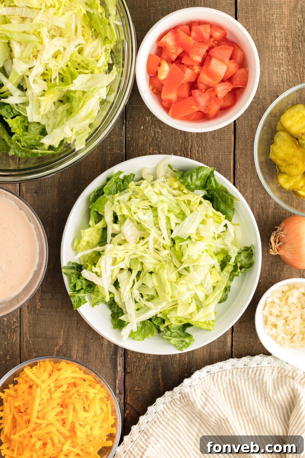 Big Mac Makeover Salad 6 Fresh green lettuce mix perfectly arranged on a plate, forming the vibrant base for assembling the Big Mac Salad.