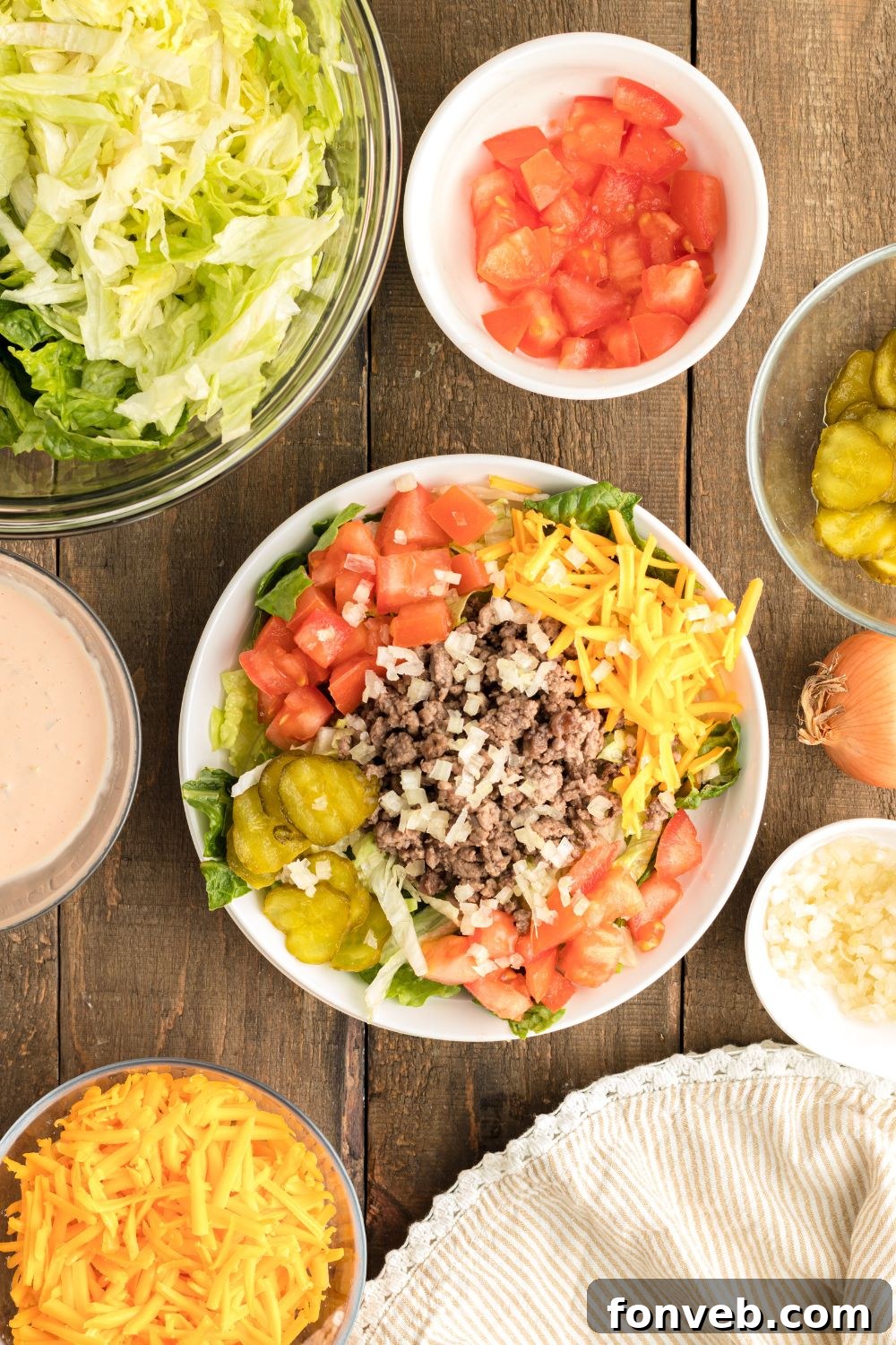 Big Mac Makeover Salad 8 A fully assembled Big Mac Salad presented on a clean plate, showcasing all the vibrant toppings and layers.