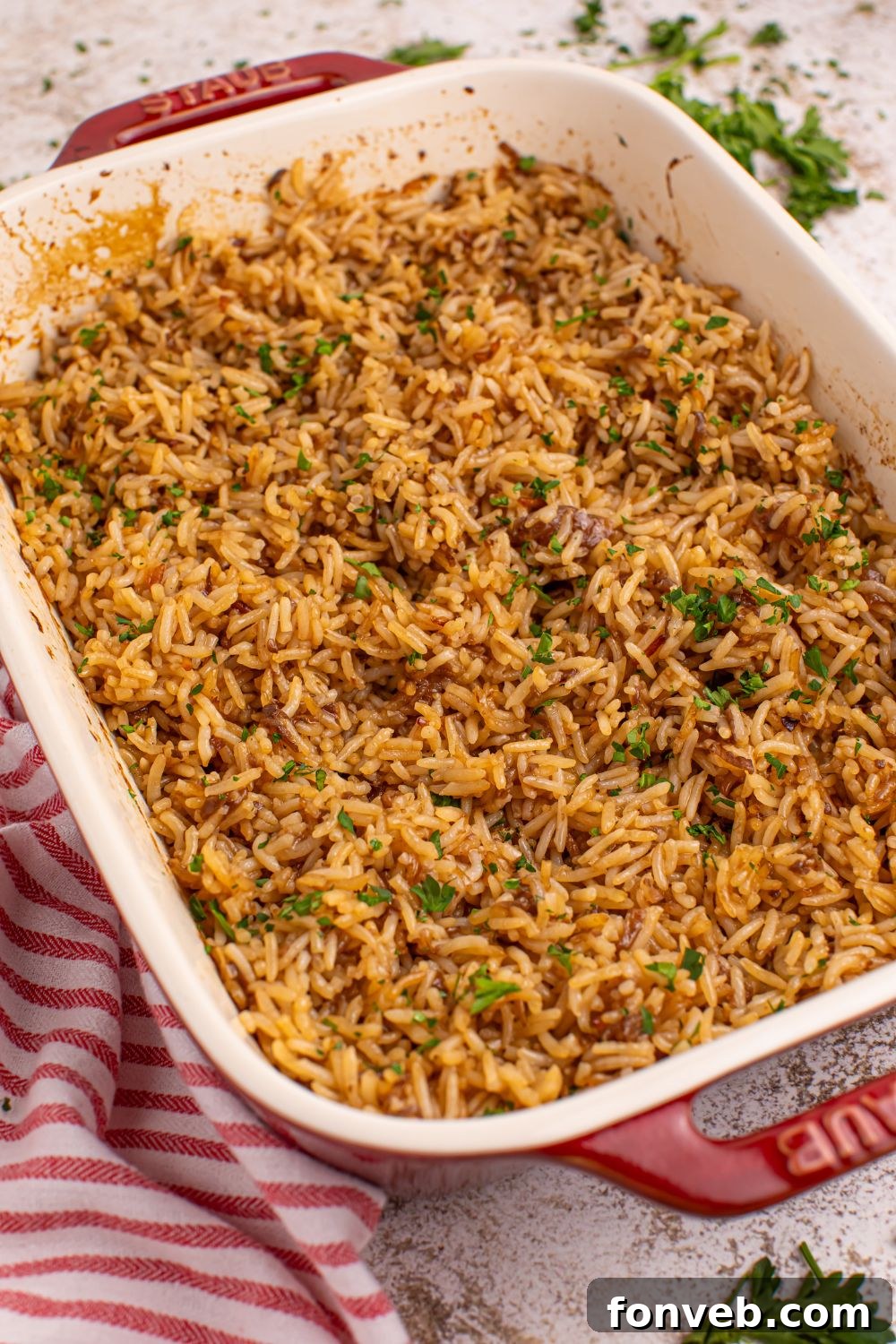 Stick of Butter Rice in a pan with a red striped towel on side 