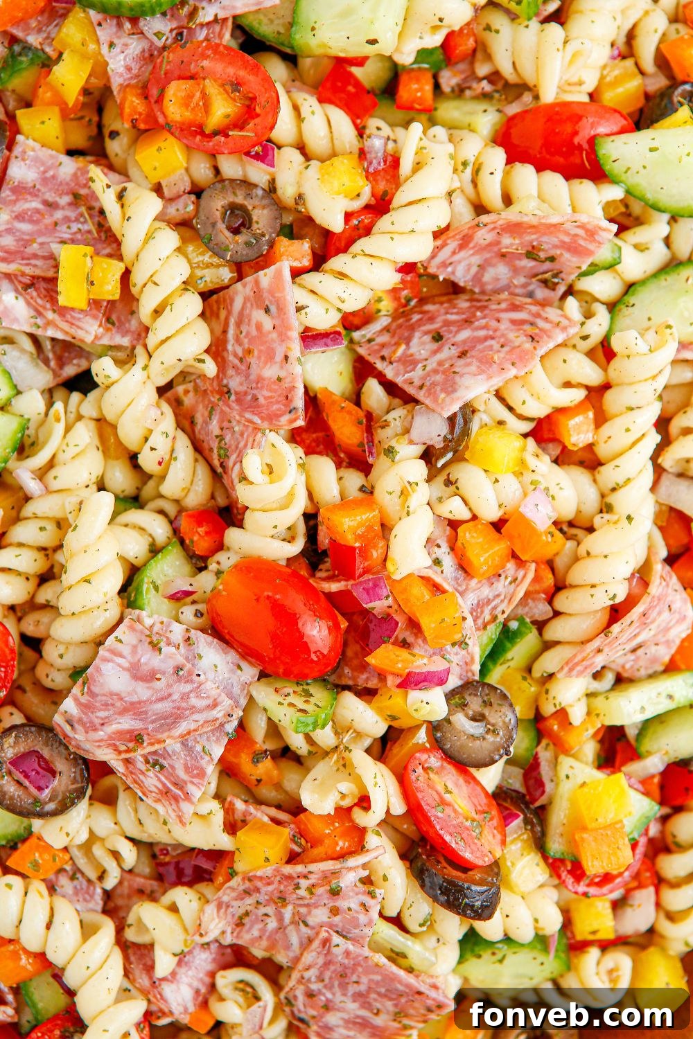 Close-up of Summer Pasta Salad in a bowl, showcasing the generous amounts of meat, vegetables, and pasta.