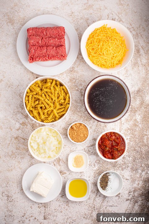 Taco Macaroni and Cheese served in a white bowl with a side of fresh salad, highlighting a complete meal.