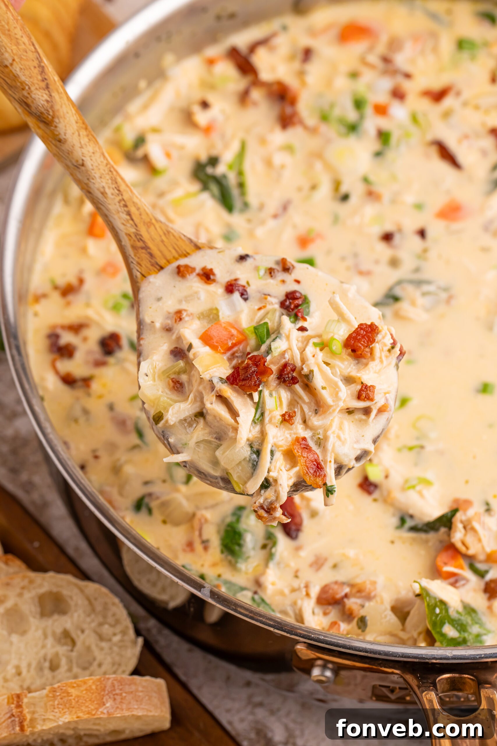 Hearty Crack Chicken Soup simmering in a large cooking pot, rich and inviting