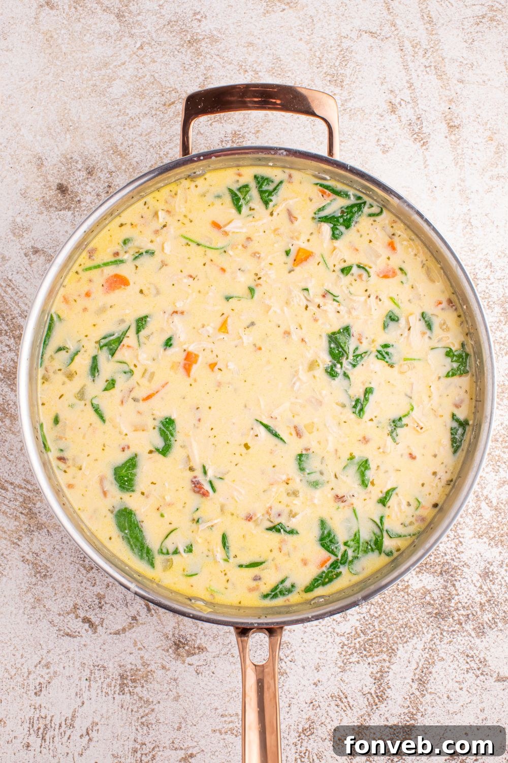 A large pot filled with rich, creamy Crack Chicken Soup, beautifully textured and inviting